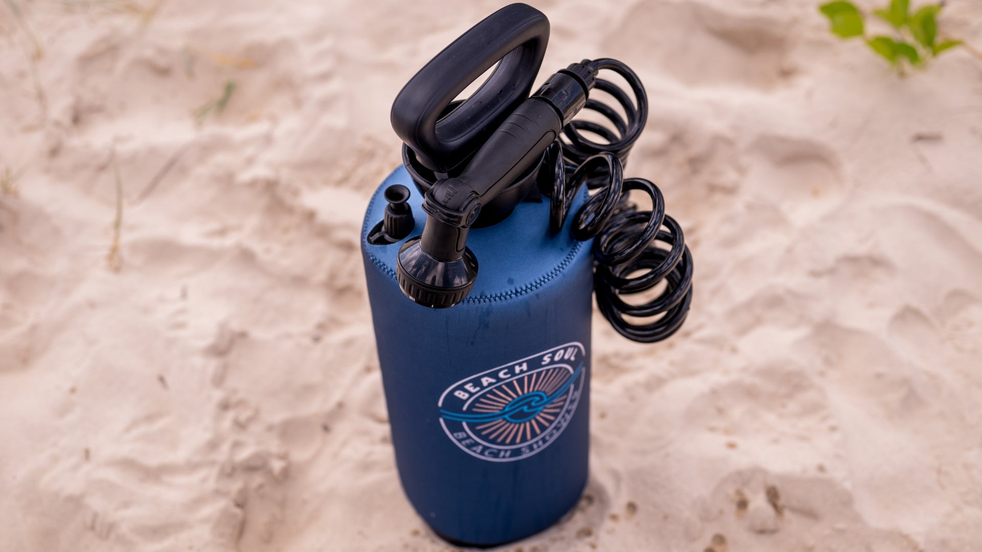 Beach Soul Portable Shower 8L Ocean Rise design standing on the sand