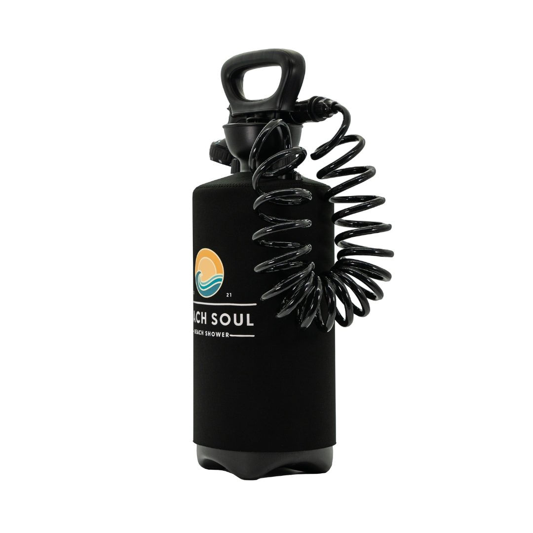 Angled rear view of the Original Beach Soul portable shower with coiled hose