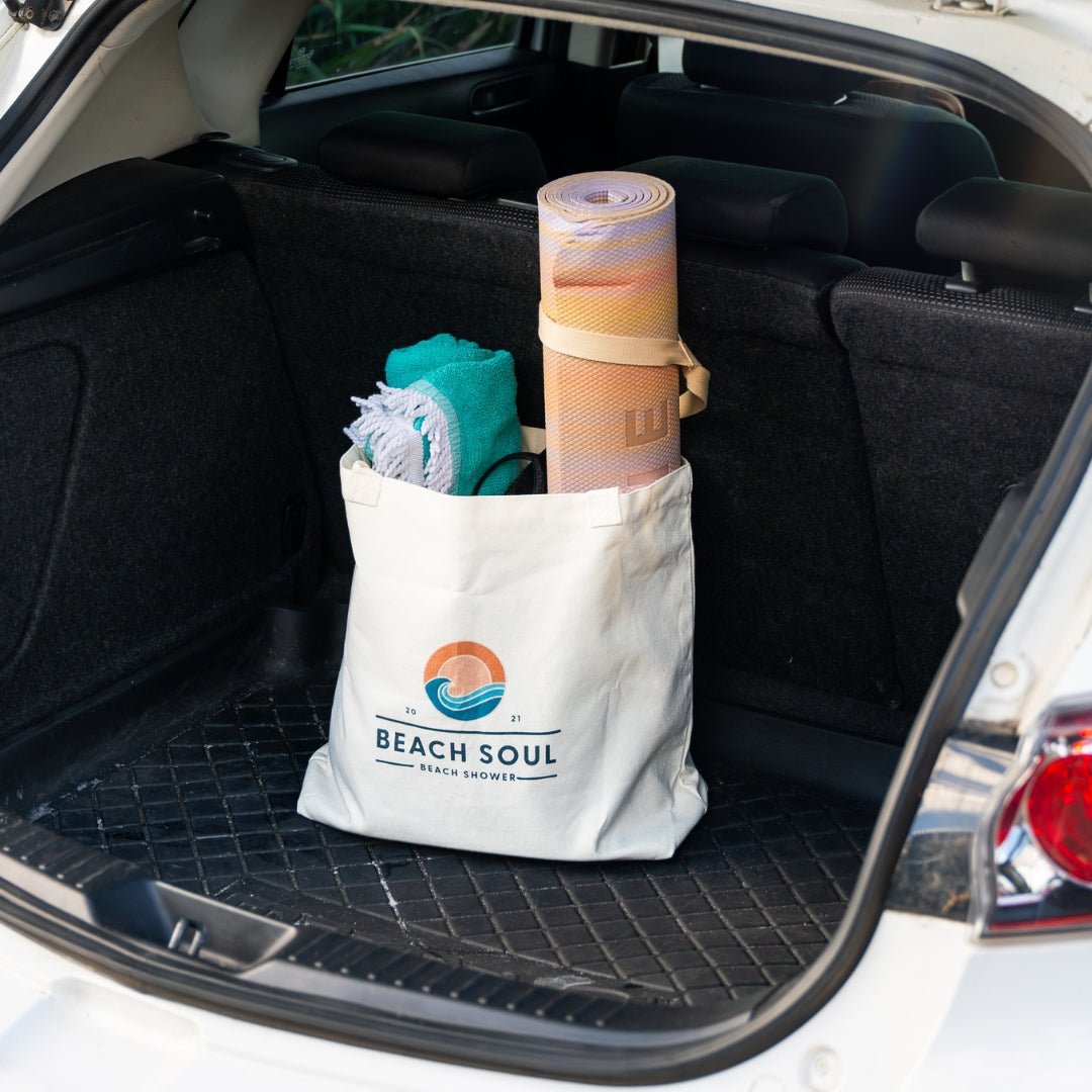 Natural Beach Soul Beach Bag holding a yoga mat and beach gear in an open car boot