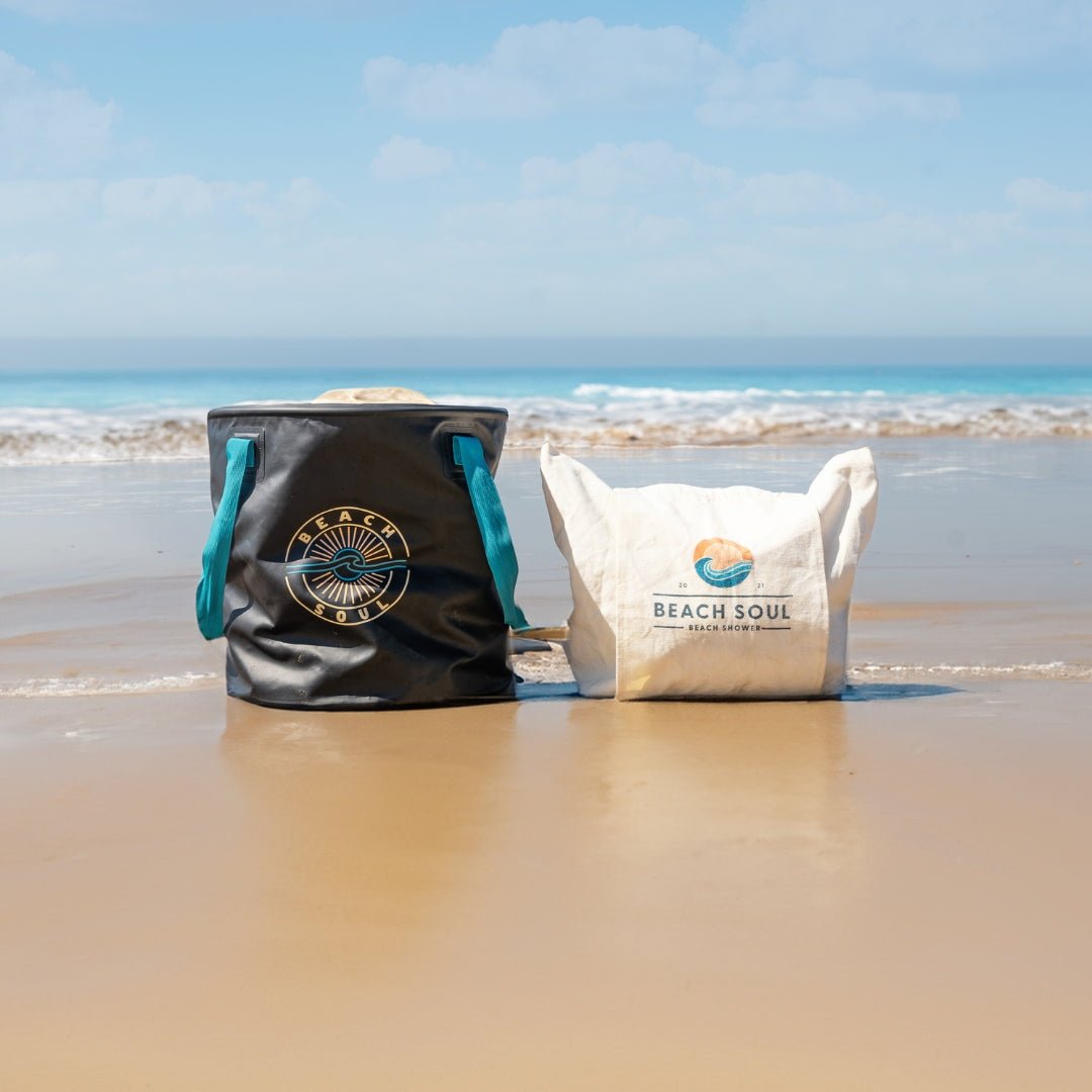 Natural Beach Soul Beach Bag and Bag 'n' Mat standing together on wet sand