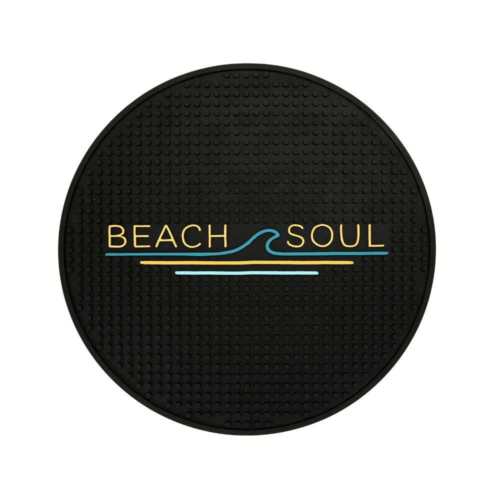 Round black Beach Soul outdoor shower mat with grooved surface and logo