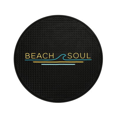Round black Beach Soul outdoor shower mat with grooved surface and logo